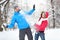 Young couple in snowball fight