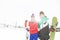 Young couple with snowboard and skis in snow