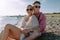 Young couple spending time at sea, enjoying summer.