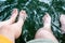 Young couple splashing feet in the water in summer lake