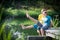 Young couple splashing water at lake