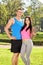 Young couple in sportswear posing in park