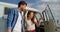 Young couple standing near camper van 4k