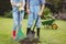 Young couple standing near a sapling in garden