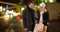 Young couple standing outside with shopping bags