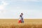 Young couple standing in wheat field back to each other. Support in family