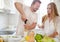 Young couple starting to drink a white wine at home