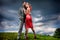 Young couple with storm cloudy sky