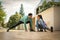 Young couple stretching on the sidewalk after running.