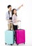 Young couple with suitcase going on vacation