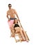 Young couple with sun lounger on white background.  accessories