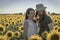 Young couple at sunflowers field