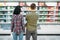 Young couple in supermarket, milk department