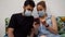 A young couple with surgical masks are using a mobile phone