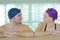 Young couple swimmers inside swimming pool