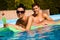 Young couple in swimming pool