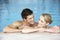 Young Couple Swimming In Pool