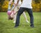 Young couple swinging daughter between them