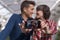 young couple taking a selfie with mobile phone and smiling. Love concept. Indoors