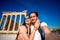 Young couple taking selfie picture with Erechtheum temple on background in Acropolis