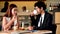 Young couple talking in cafe coffee shop happy date couple communication positive relationship while relaxing in cafe drinking cof