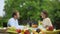 Young couple talking while having lunch, non gmo fruits, pesticide free food