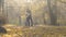Young couple tenderly hugging in autumn forest, romantic gesture, people in love