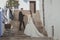 Young couple on their wedding day, on a large stairway