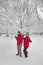 Young couple throwing snowballs