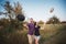 Young couple tossing hats into the air