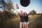 Young couple tossing hats into the air