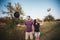 Young couple tossing hats into the air