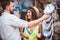 Young couple of tourists buying Captain`s cap in gift street stall outdoor