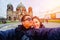 Young Couple Tourists selfie with mobile phone near Berlin Cathedral Berliner Dom at famous Museumsinsel Museum Island with
