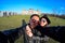 Young Couple Tourists selfie with mobile phone near the Reichstag building german government in Berlin, Germany