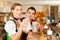 Young couple in traditional Bavarian Tracht in restaurant or pub
