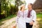 Young couple in a traditional Ukrainian clothing, have fun spending time in the Park