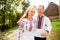 Young couple in a traditional Ukrainian clothing, have fun spending time in the Park