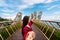 Young couple traveler in red dress enjoying at Golden Bridge in Bana hills, Danang Vietnam, Travel lifestyle