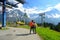 Young couple of travelers enjoying a mountains view in the summer at cabel car station ,Grindelwald Switzerland,