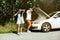 Young couple traveling on the car in sunny day