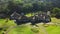 Young couple in a villa in romantic landscape in mountains in Bedugul, Bali, Indonesia. Aerial view 4K.