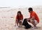 A young couple of volunteers cleans plastic and garbage