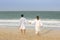 Young couple waling at the beach in Dubai