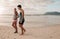 Young couple on walking along the shore