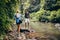 Young couple walking by the mountain stream