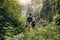 Young couple walking through woods