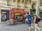 Young couple walks toward sandwich shop in Paris