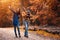 A young couple walks in the woods with a little boy