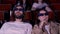 Young couple watching horror movie in 3D glasses. Media. Man and woman looking frightened and shocked while watching